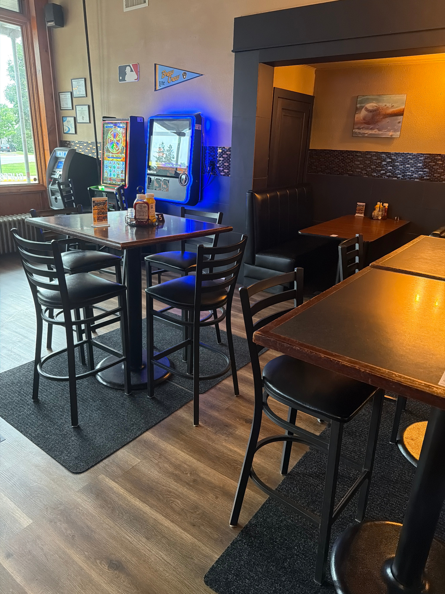 Dining area with high-top tables and booths after the remodel